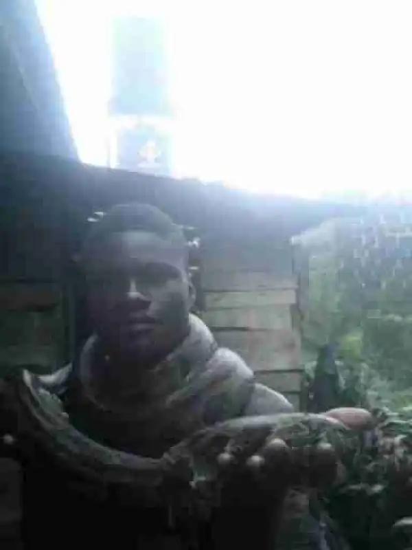 Young Nigerian Man kills Snake, Wraps it Around his Neck